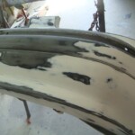 Before and after photographs of a damaged Chevy Impala that was repaired by Elite Paint & Body Shop in West Palm Beach, Florida.
